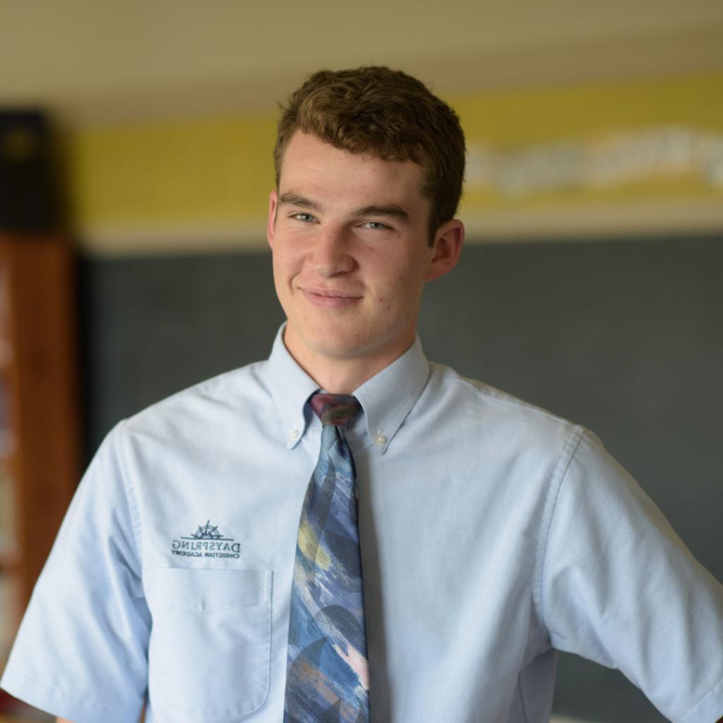 Male Honors school student smiling